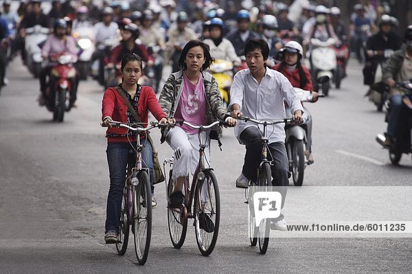 Children on bicycles  Hanoi  Vietnam  Indochina  Southeast Asia  Asia