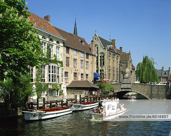 Tourist boat trip on canals of Bruges  Belgium  Europe