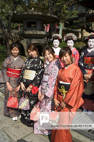 Girls wearing yukata - kimono  geisha  maiko (trainee geisha) in Gion  Kyoto city  Honshu  Japan  Asia