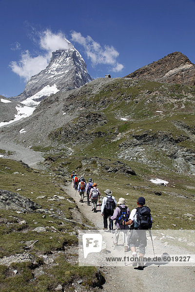 Hikers in front of Matterhorn  Schwarzsee  Zermatt  Valais  Swiss Alps  Switzerland  Europe