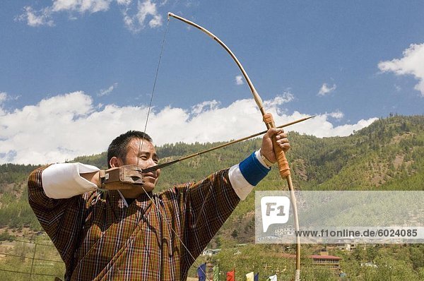 Man practising the national sport of archery  Thimpu  Bhutan  Asia