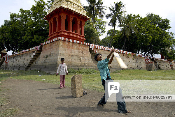 Kids playing cricket  Tamil Nadu  India  Asia