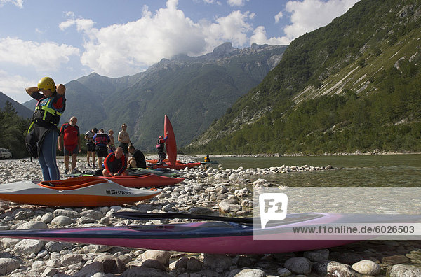 Group of people getting ready for canoeing on the Soca River  Triglav National Park  Julian Alps  Slovenia  Europe