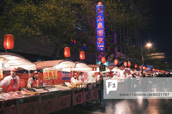 A street market selling local food in Wangfujing shopping street  Beijing  China  Asia