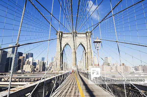 Pedestrian walkway on the Brooklyn Bridge looking towards Manhattan  New York City  New York  United States of America  North America