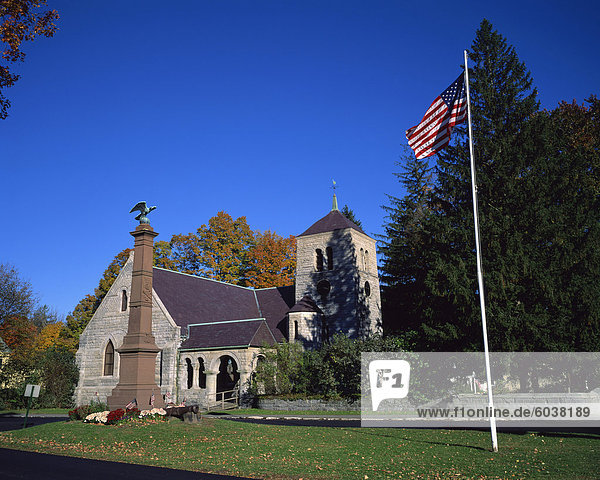 American flag flies outside St. Pauls church on the main street of Stockbridge  a town in the Berkshires  Massachusetts  New England  United States of America  North America