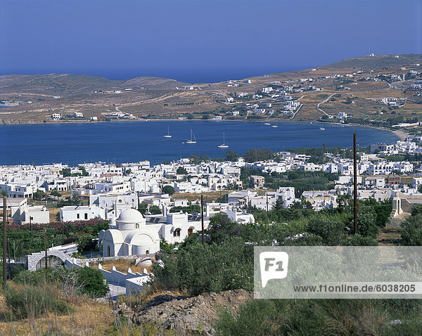 White church and houses overlooking a bay on Paros  Cyclades Islands  Greek Islands  Greece  Europe