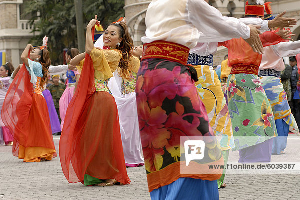 Malay female dancers wearing traditional dress at celebrations of Kuala Lumpur City Day Commemoration  Merdeka Square  Kuala Lumpur  Malaysia  Southeast Asia  Asia