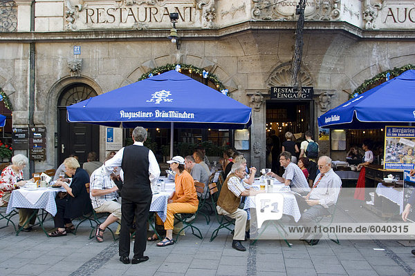 People sitting outside the popular Augustiner restaurant  Munich  Bavaria  Germany  Europe