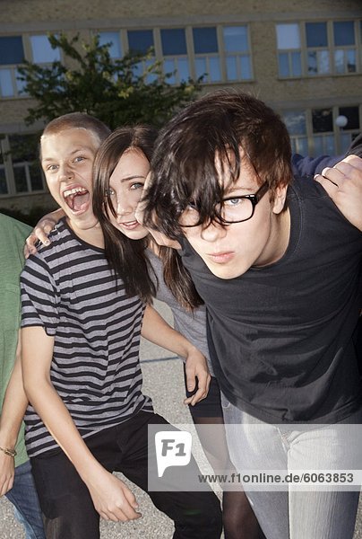 Teenagers playing on schoolyard