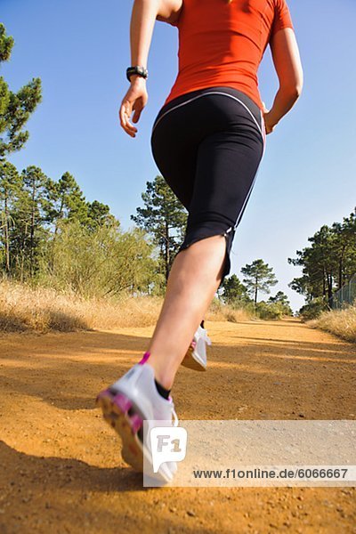 Young woman jogging  low section