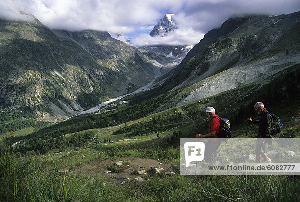 Two older males hiking the Swiss Haute Route from Verbier to Zermatt through the heart of the Alps.