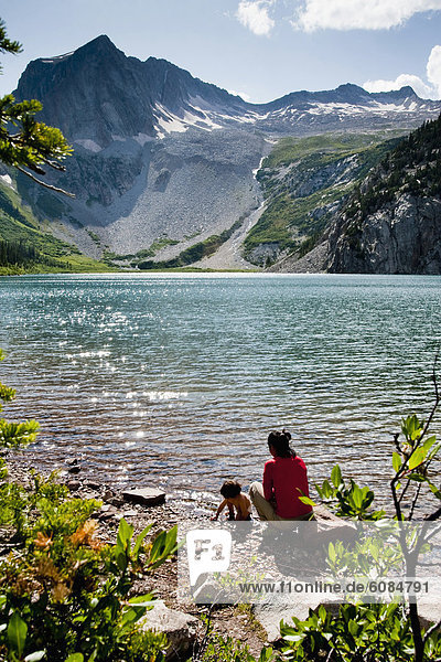 A mother and her 14 month old son play on the shore of Snowmass Lake (10 980ft) on August 10  2009 in the Maroon Bells in the Snowmass Wilderness just outside of Aspen.