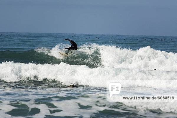 A man surfs on The Lost Coast  California.