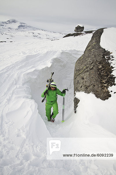 Sweden  Skier walking uphill