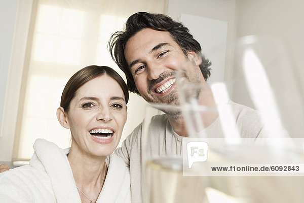 Germany  Berlin  Mature couple in bathroom with sparkling wine