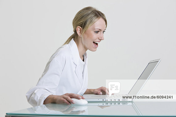 Medical secretary using laptop