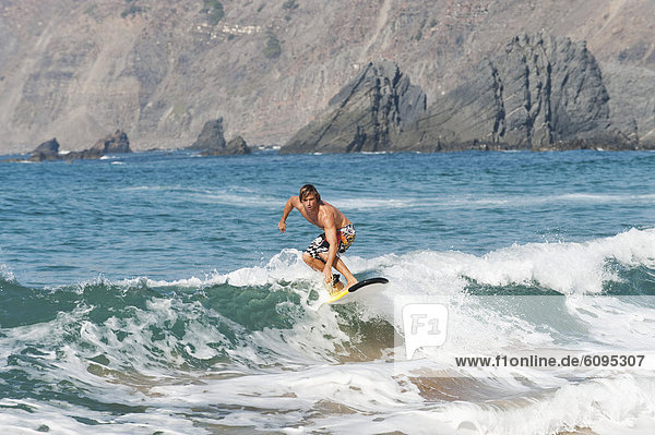 Portugal  Surfer surfing on waves