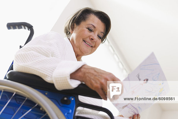Senior woman sitting on wheelchair
