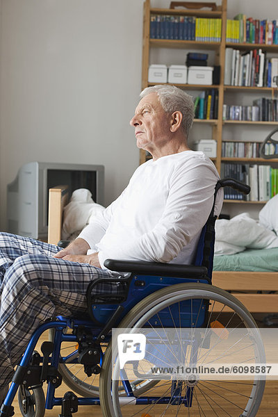 Senior man sitting on wheelchair