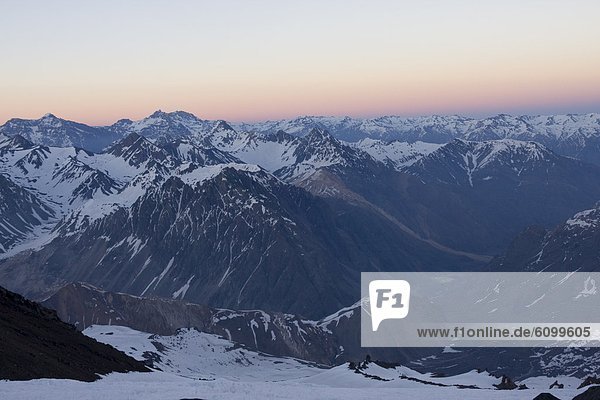 A view of the Andes Mountains at sunset above the Maipo Valley in Chile
