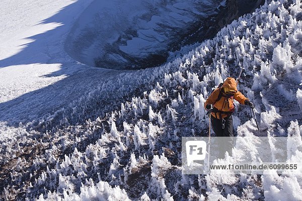 A woman mountain climbing on Volcan San Jose in the Andes mountains of Chile