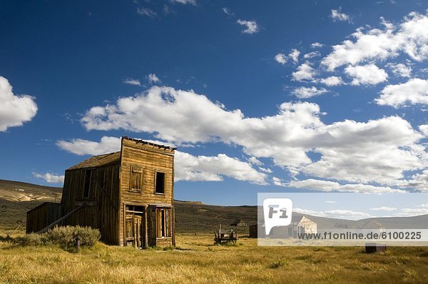 Old rundown buildings in afternoon light in the ghost town of Bodie  CA.