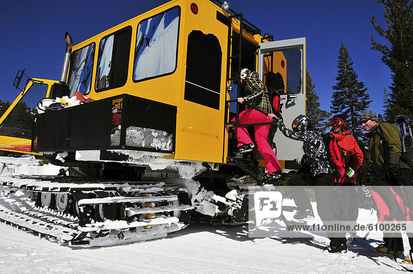 Skiers and snowboarders load into a snowcat at Kirkwood Mountain Resort  CA.