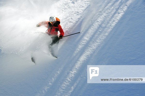 A male skier makes a big powder turn in the Kirkwood backcountry  CA.