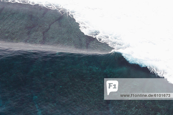 Aerial view of an empty wave breaking at Tavarua  Fiji
