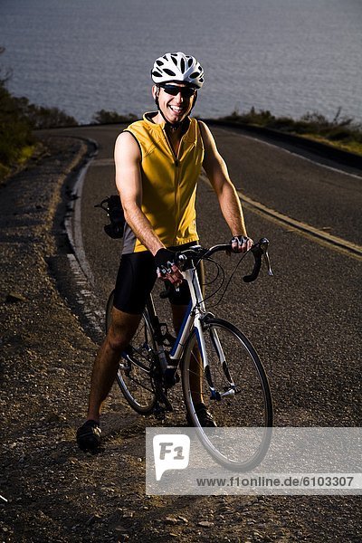 A road cyclist poses for a portrait in Malibu  California.