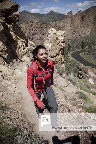 Female hiking rocky trail.