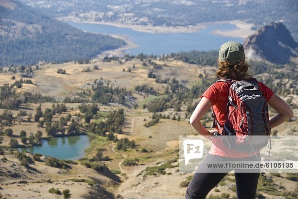 A woman takes in the view on a hike near Carson Pass in the Sierra Nevada  California.
