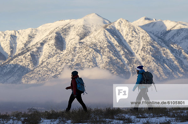 Two women hiking in the Sierra Foothills outside of Lake Tahoe  California.