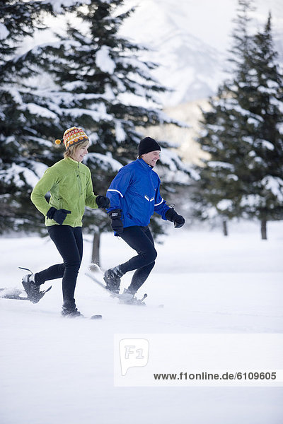 Couple snowshoeing in Canada.