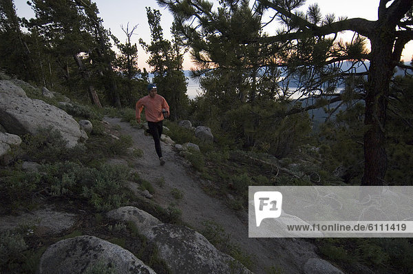 Trail runner with headlamp.