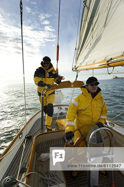 Two men on a sailing yacht.