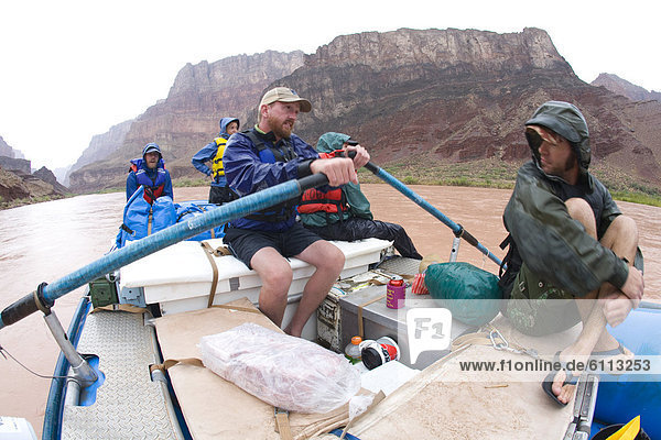 Five people in a raft in the Grand Canyon.