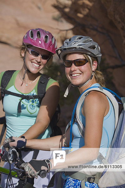 portrait of two women mountain bikers.