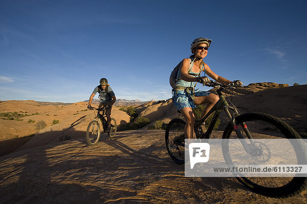 couple mountain biking  Moab  Utah
