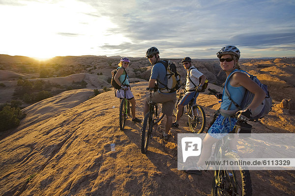 group taking a break while mountain biking in Moab  Utah