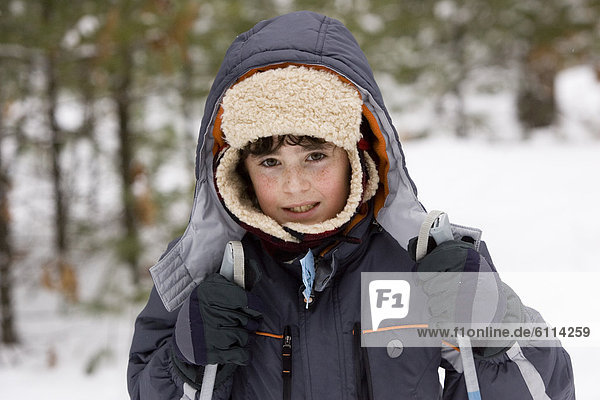 Portrait of young boy  while Cross Country Skiing in Dayton  Maine.