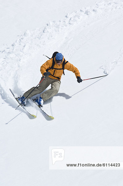 Lone skier making turns in alpine environment  Washington.