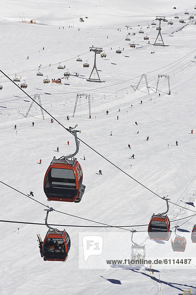 View of the Schaufeljochbahn Gondola with surface lifts and a chairlift in the background at Stubai Glacier Ski Resort  near Inn