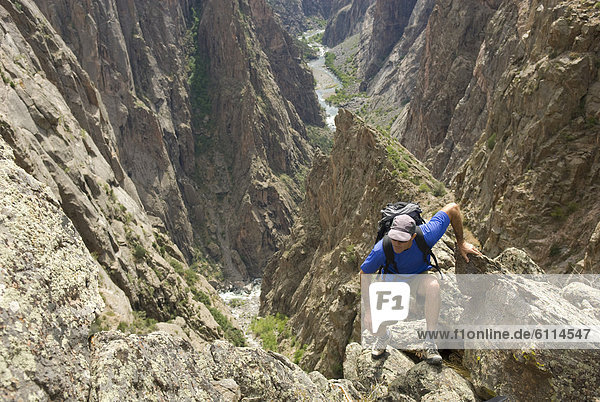 Man hiking on the North Rim of the Black Canyon of the Gunnison  Colorado.
