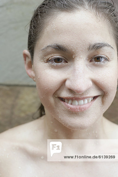 Close up view of a wet woman smiling