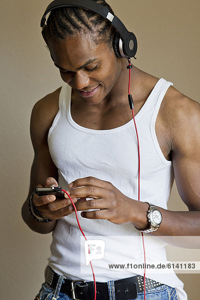 Smiling man listening to headphones