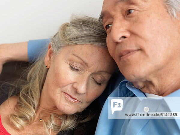 Older woman napping on husband