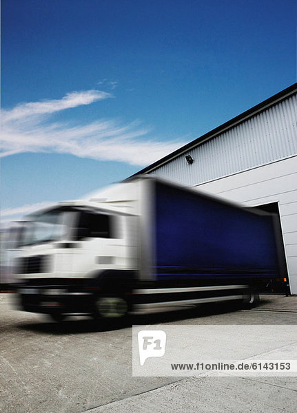 Truck leaving distribution warehouse