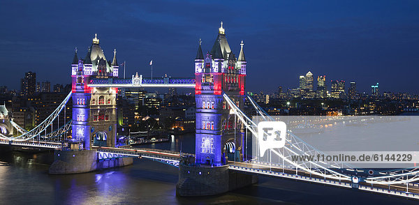 Tower Bridge at dusk with special illumination  Canary Wharf at back  London  England  United Kingdom  Europe
